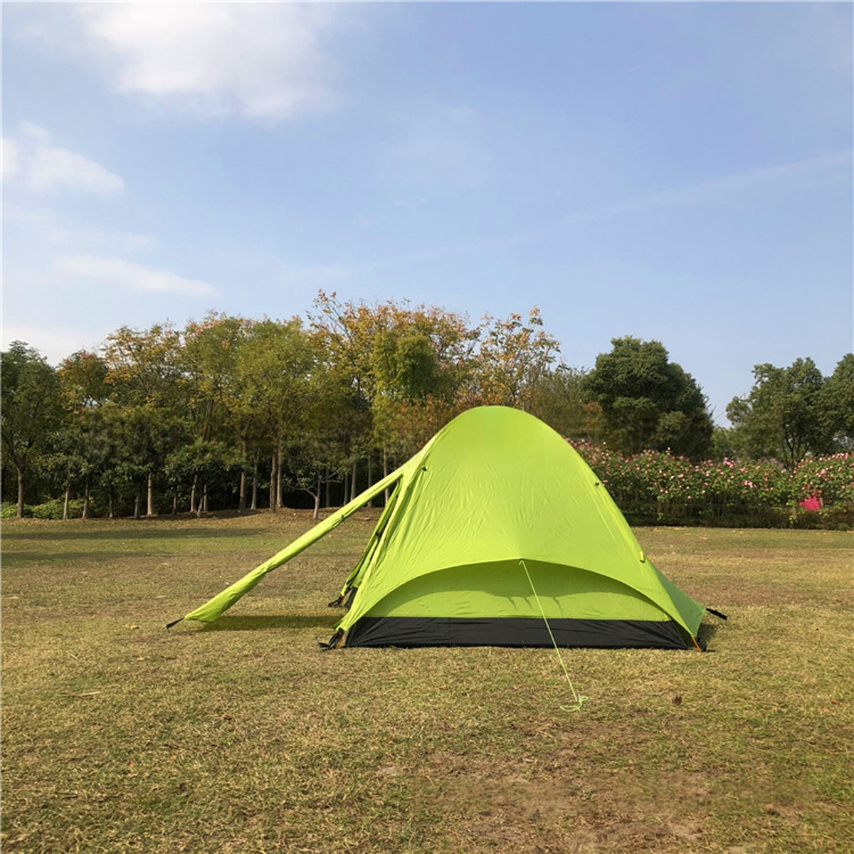 User demonstrating the quick setup of ultralight 3-person camping tent