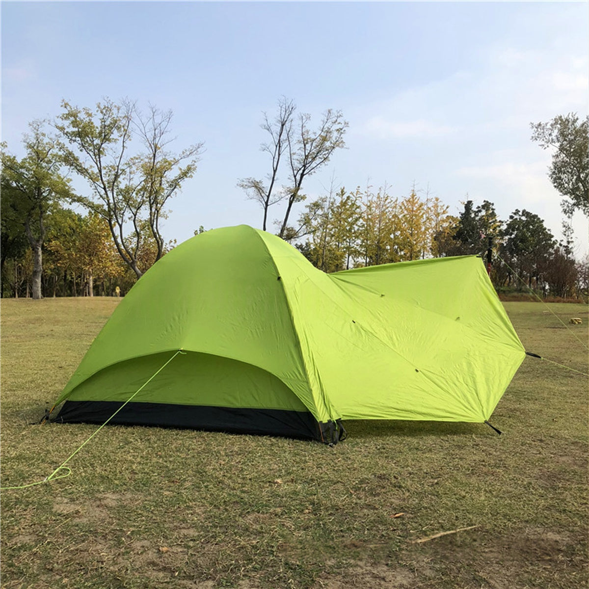 Camping tent packed in a carry bag, portable ultralight 3-person shelter