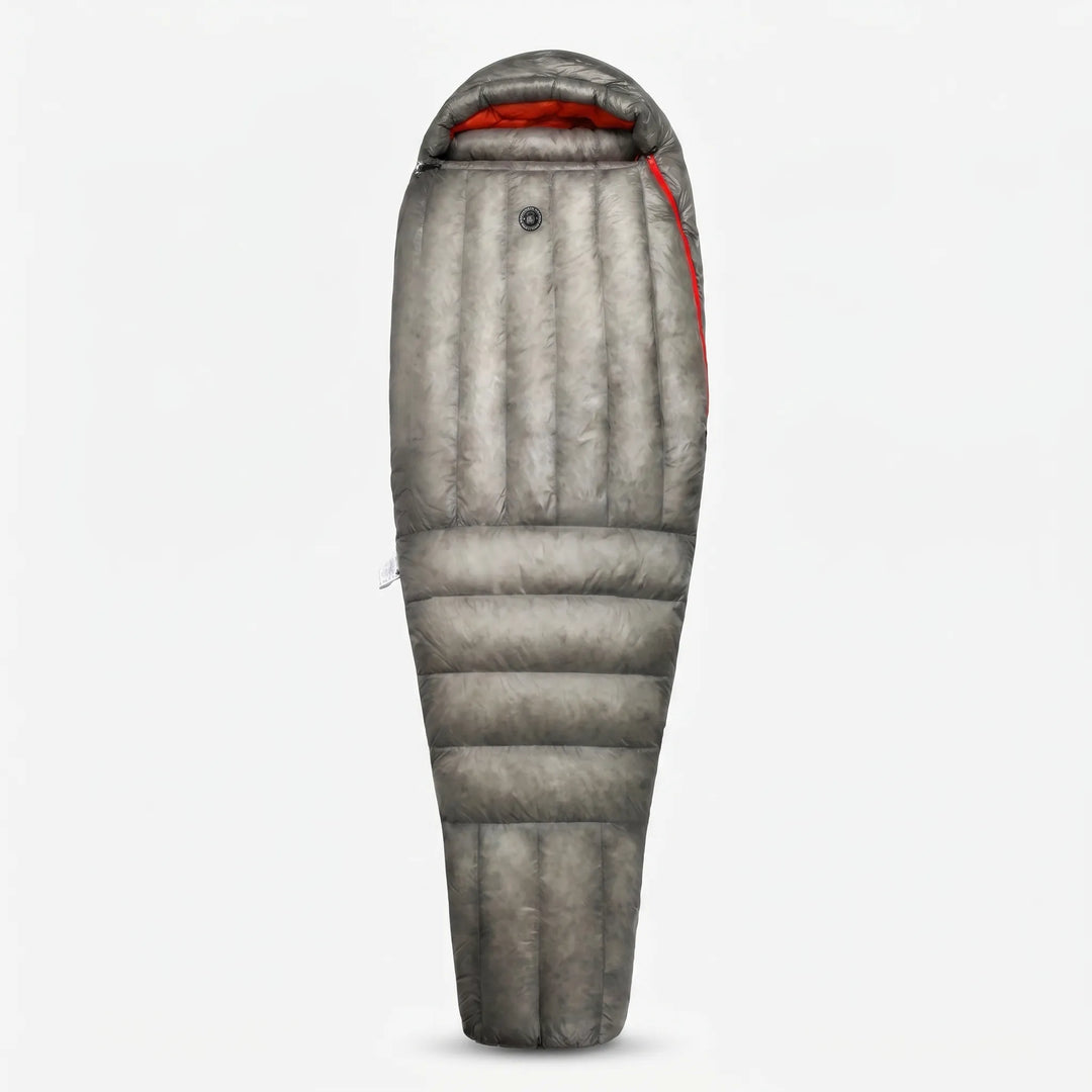Ultralight down mummy sleeping bag in a forest campsite; essential 3-season gear for backpacking & hiking.