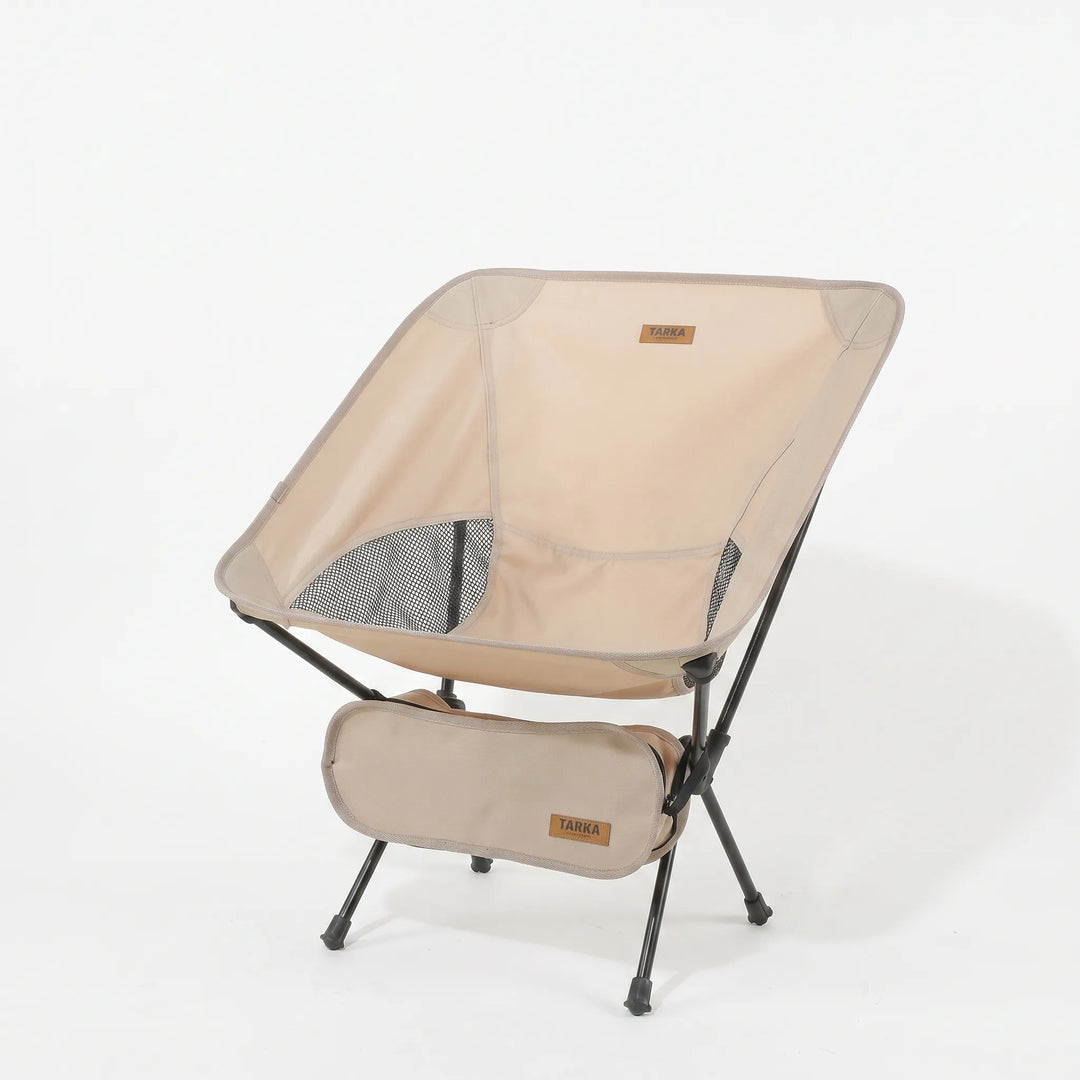Compact ultralight folding camping chair packed in its carrying bag, ready for travel & outdoor adventures.