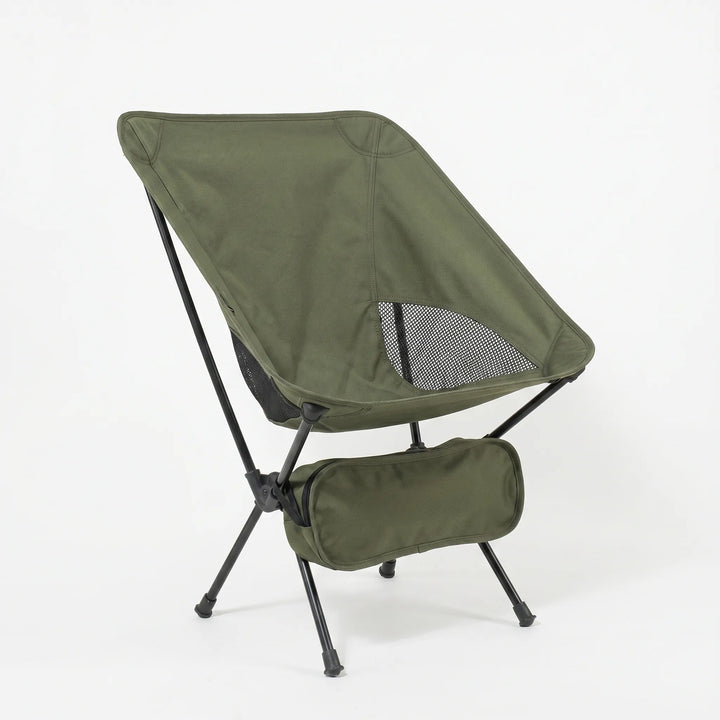 Close-up of the breathable mesh fabric and sturdy aluminum frame of a portable ultralight folding camping chair.