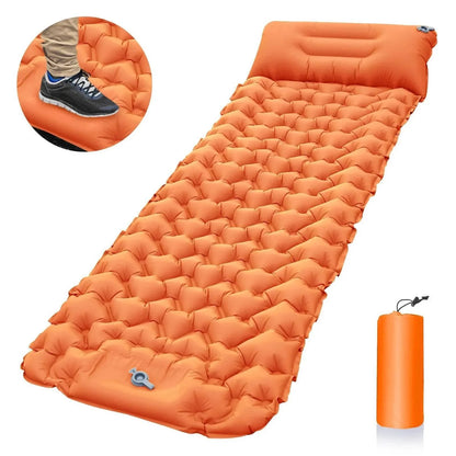 Unisex camping mattress with built-in pump and pillow area, green, full length view in nature