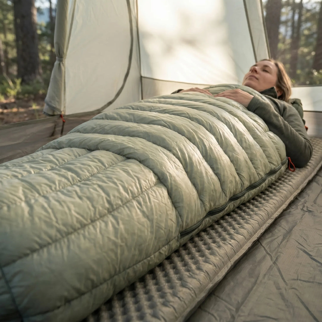 Compact ultralight down mummy sleeping bag with treated down, essential gear for backpackers & campers.