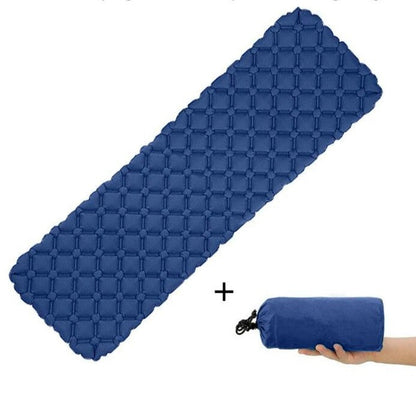 Inflated ultralight air mattress in a vibrant color, showcasing its comfortable surface for outdoor use.