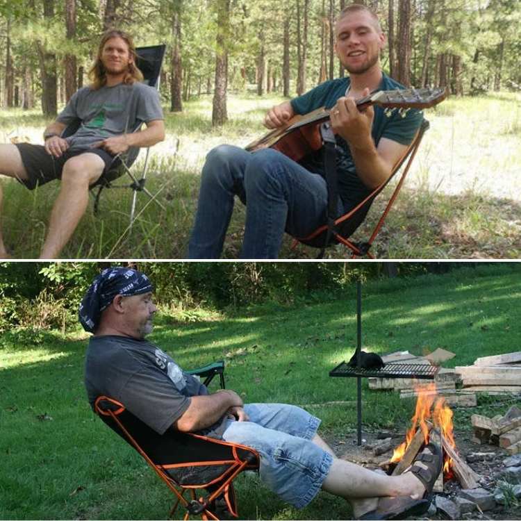 Black ultralight folding camp chair with cup holder detail, perfect portable furniture for outdoor recreation.