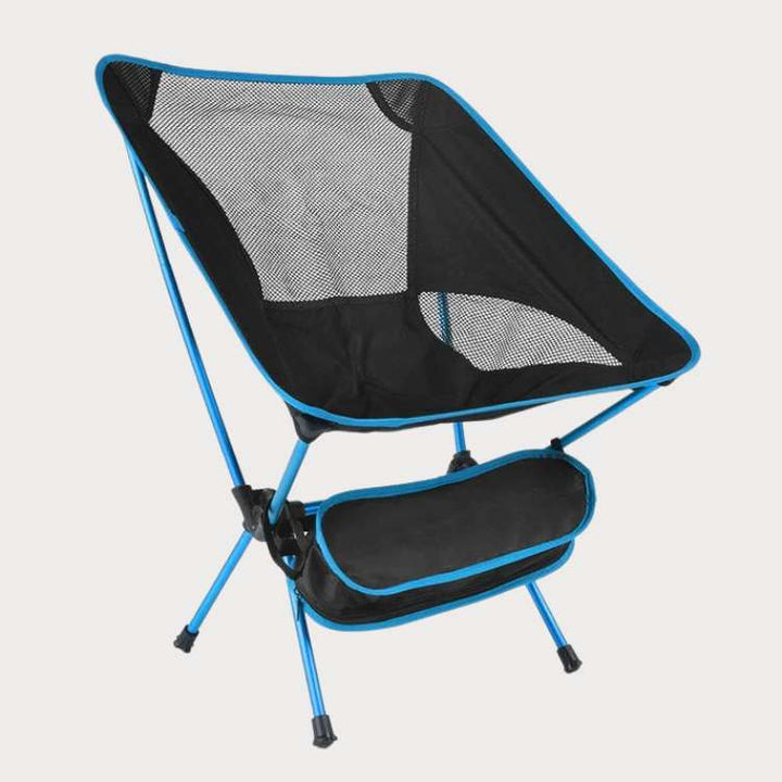 Ultralight portable folding camp chair in use at a scenic campsite, perfect for outdoor gear and comfortable seating.