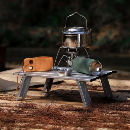 Unisex ultralight portable folding camping table in outdoor setting for picnic or travel