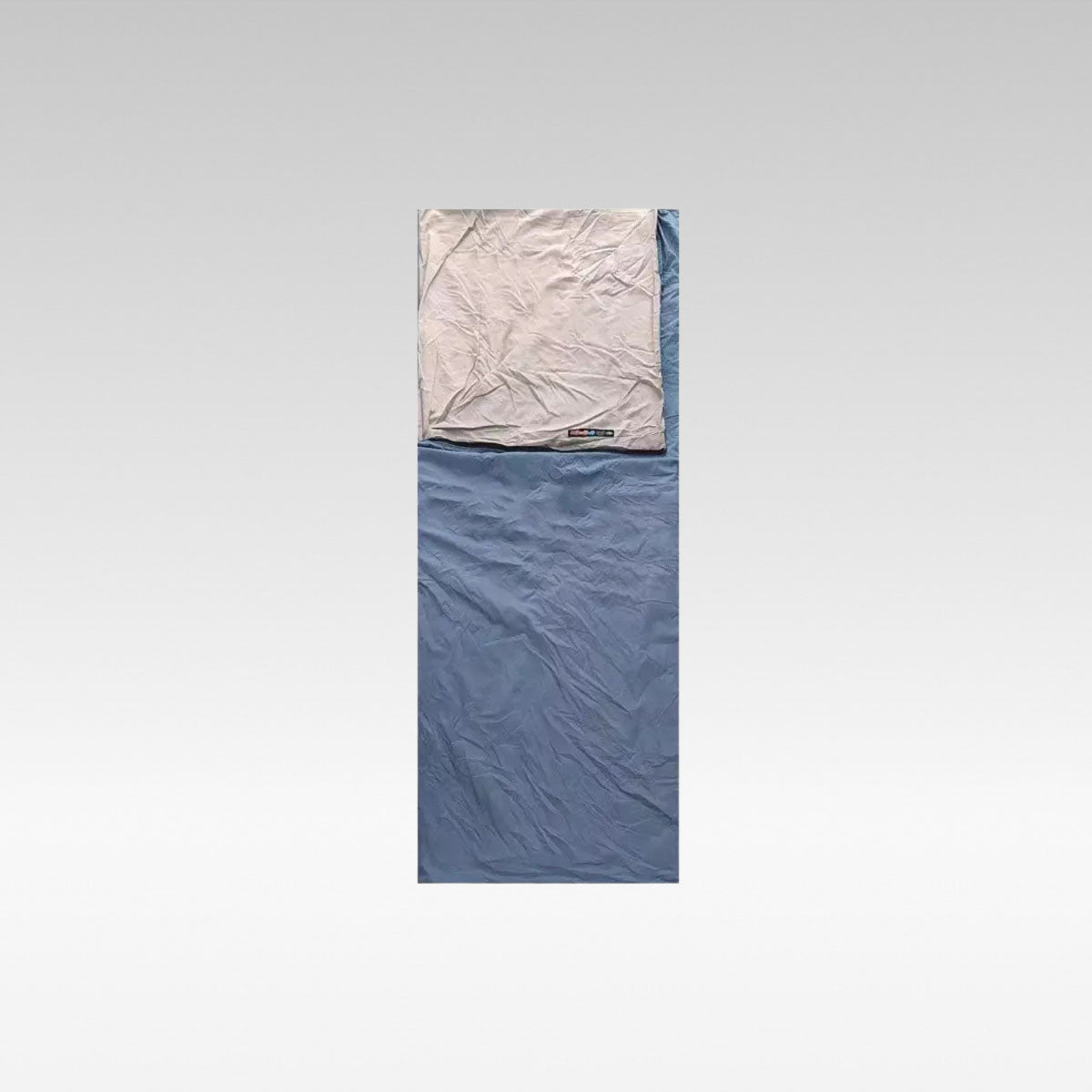 Unisex ultralight washable envelope sleeping bag for camping, side view, rolled up for travel