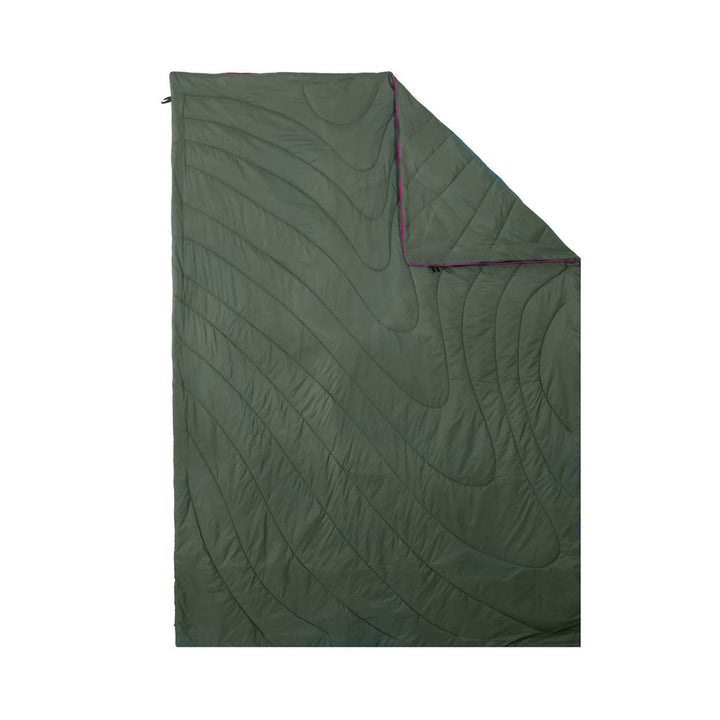 Camping blanket demonstrating its water resistance, repelling droplets.
