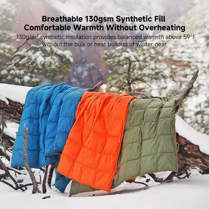 Folded wearable camping blanket, showing its compact size for travel.