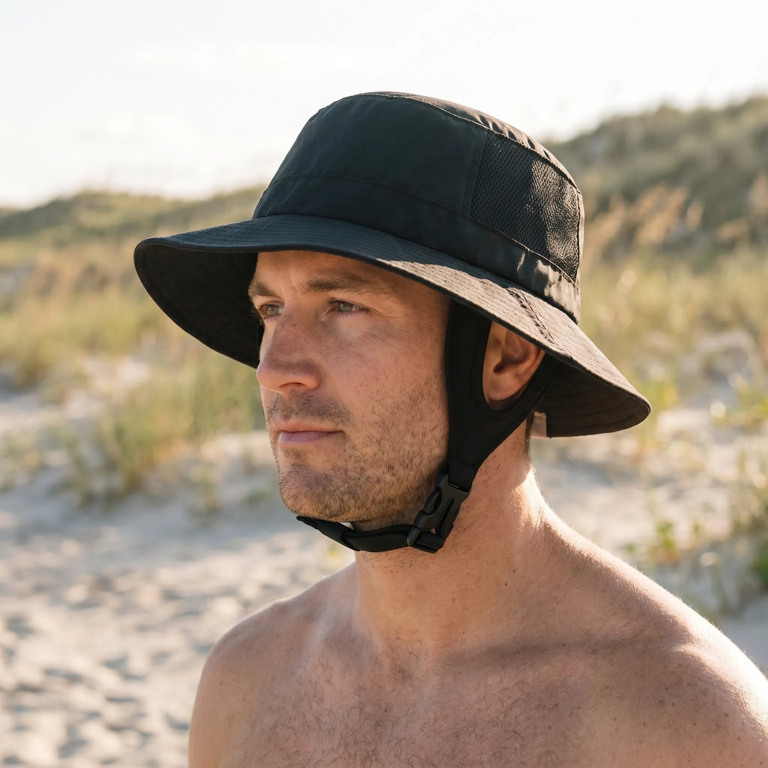 Unisex ventilated surf bucket hat for sun protection during outdoor adventures. Wide brim design.
