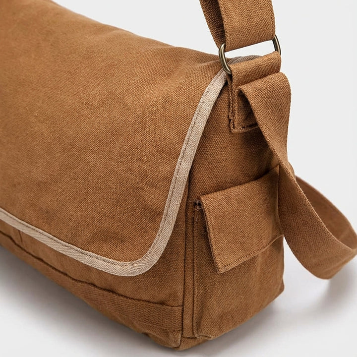 Classic vintage canvas messenger bag, perfect for students & urban explorers. Unisex shoulder bag, great for travel.