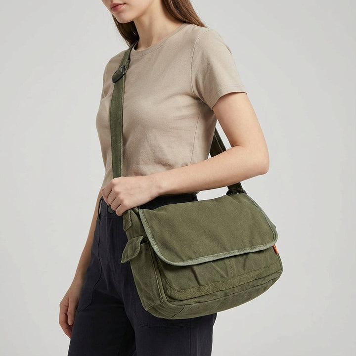 Rugged vintage canvas messenger bag, ideal for travel & daily adventures. Durable unisex shoulder & crossbody bag.