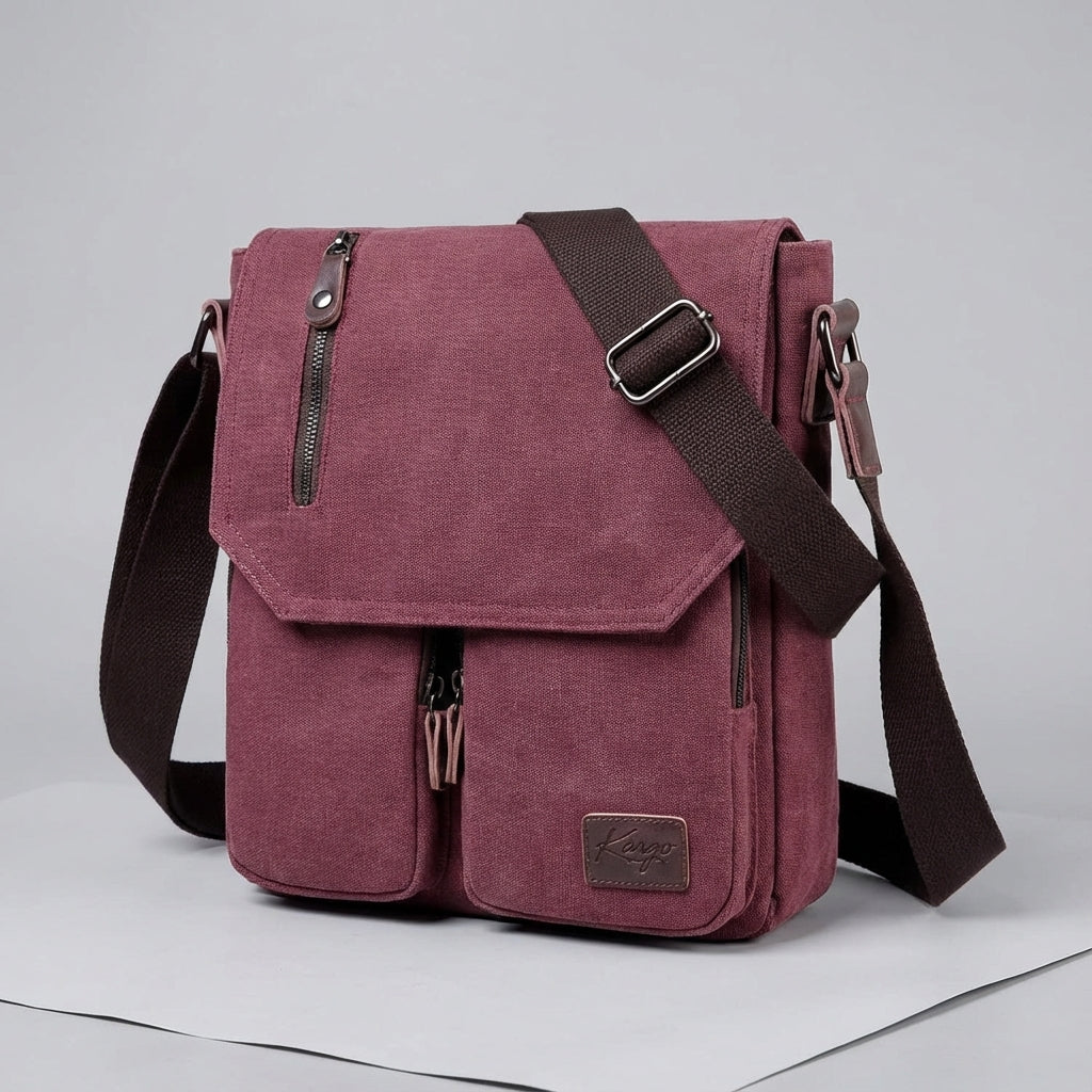 Vintage canvas crossbody bag showing multiple pockets for organized daily essentials & travel.