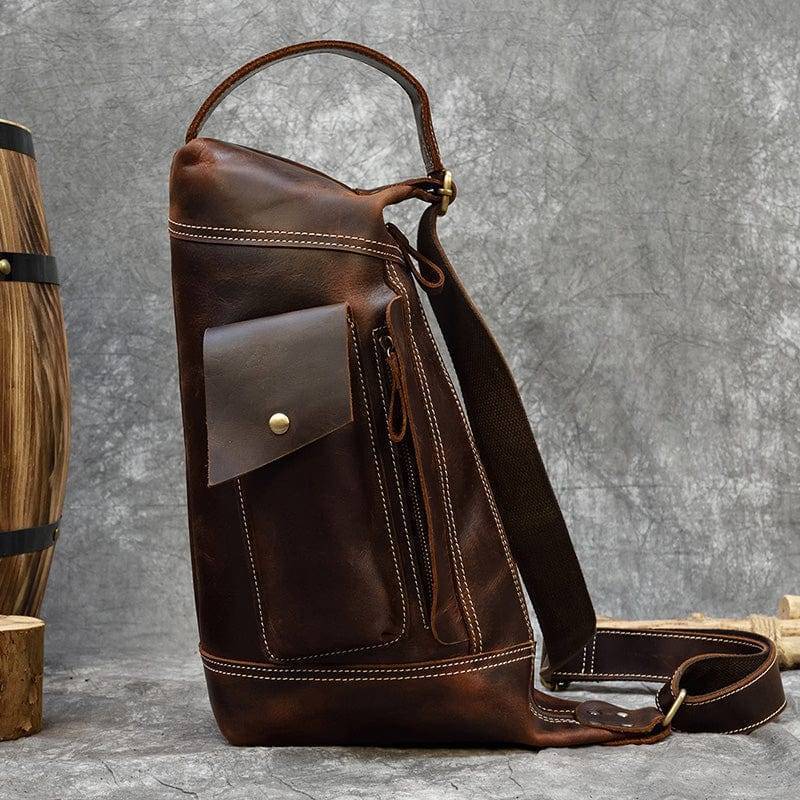 Unisex vintage Crazy Horse leather backpack, open displaying spacious interior, laptop compartment, and multiple pockets