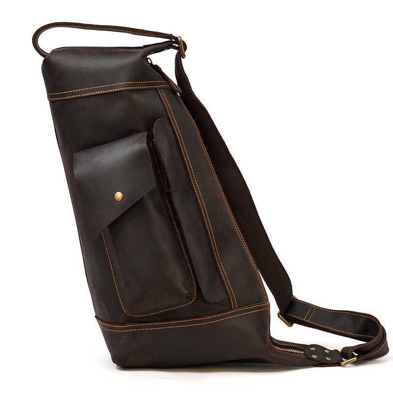 Model wearing a vintage Crazy Horse leather traveler backpack, showcasing its size and fit, practical fashion accessory