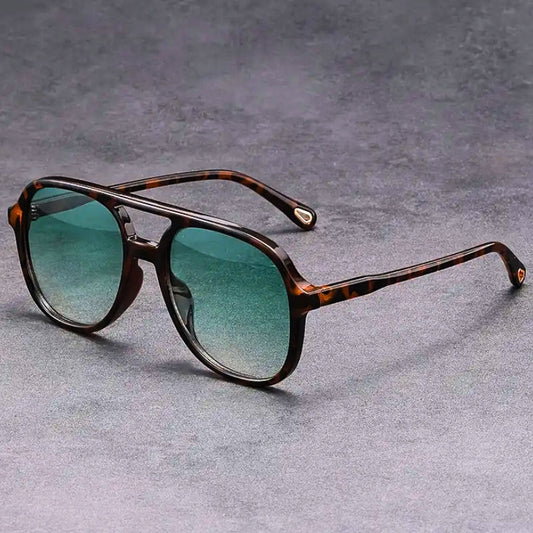 Unisex vintage-inspired sunglasses with UV400 protection, stylish for men & women. Protects eyes with retro flair.