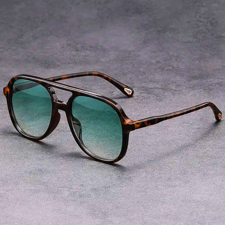 Unisex vintage-inspired sunglasses with UV400 protection, stylish for men & women. Protects eyes with retro flair.