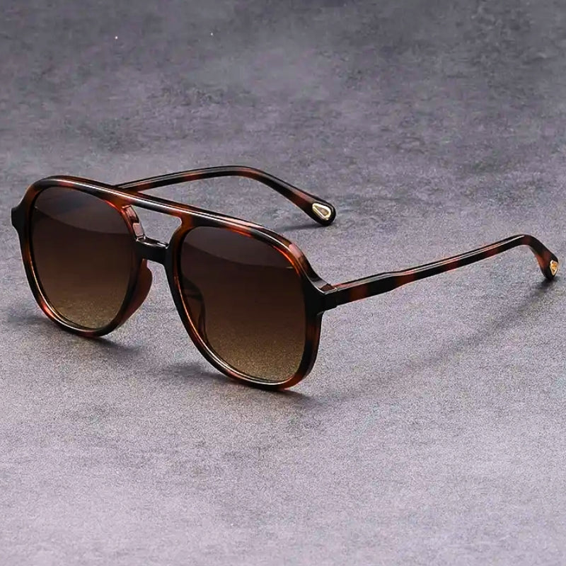 Retro-inspired unisex sunglasses offering full UV400 eye protection. Vintage style with modern sun safety.