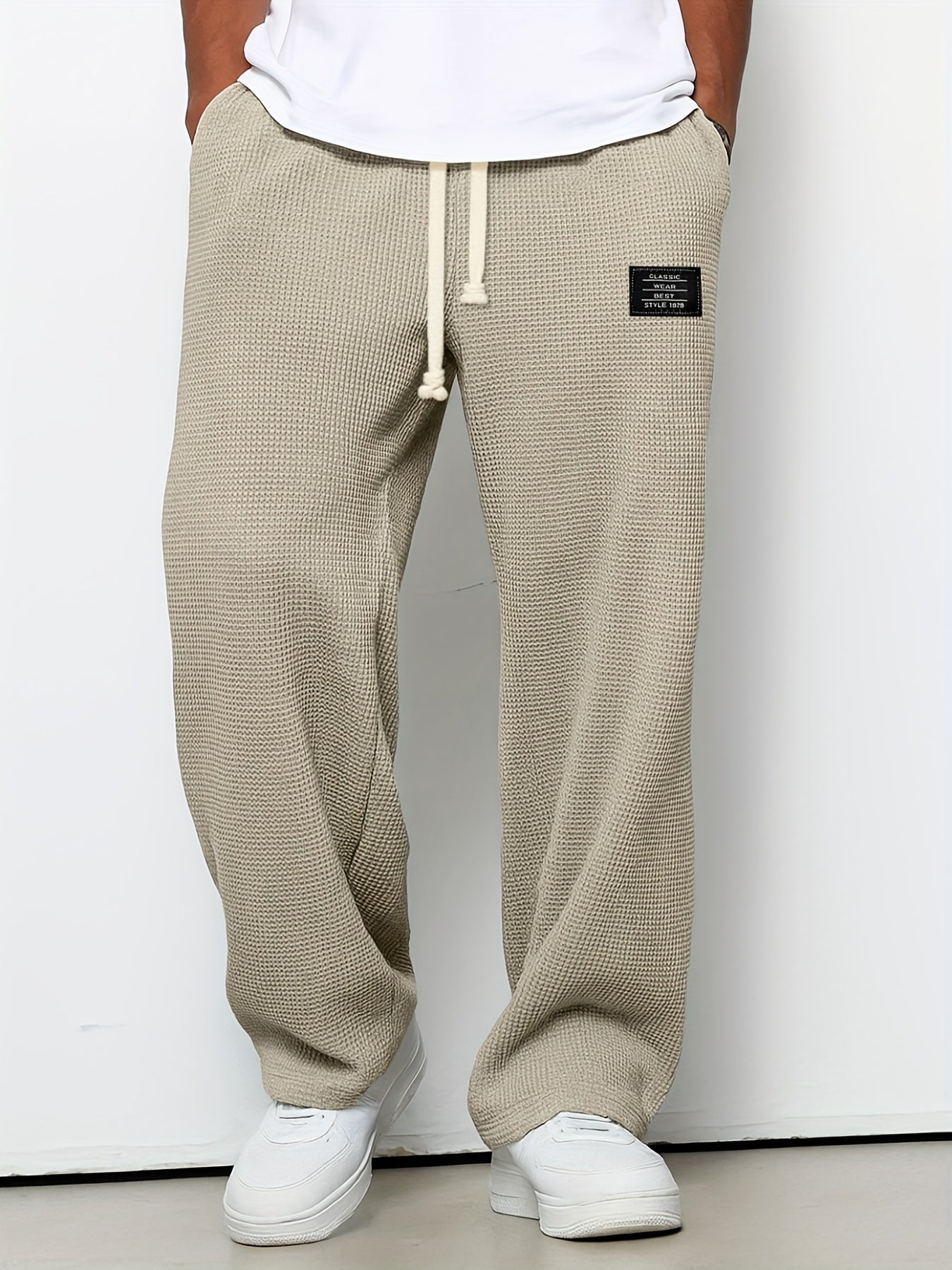 Drawstring waffle knit lounge pants, unisex design with a relaxed, soft wide leg. Ideal for comfort wear.