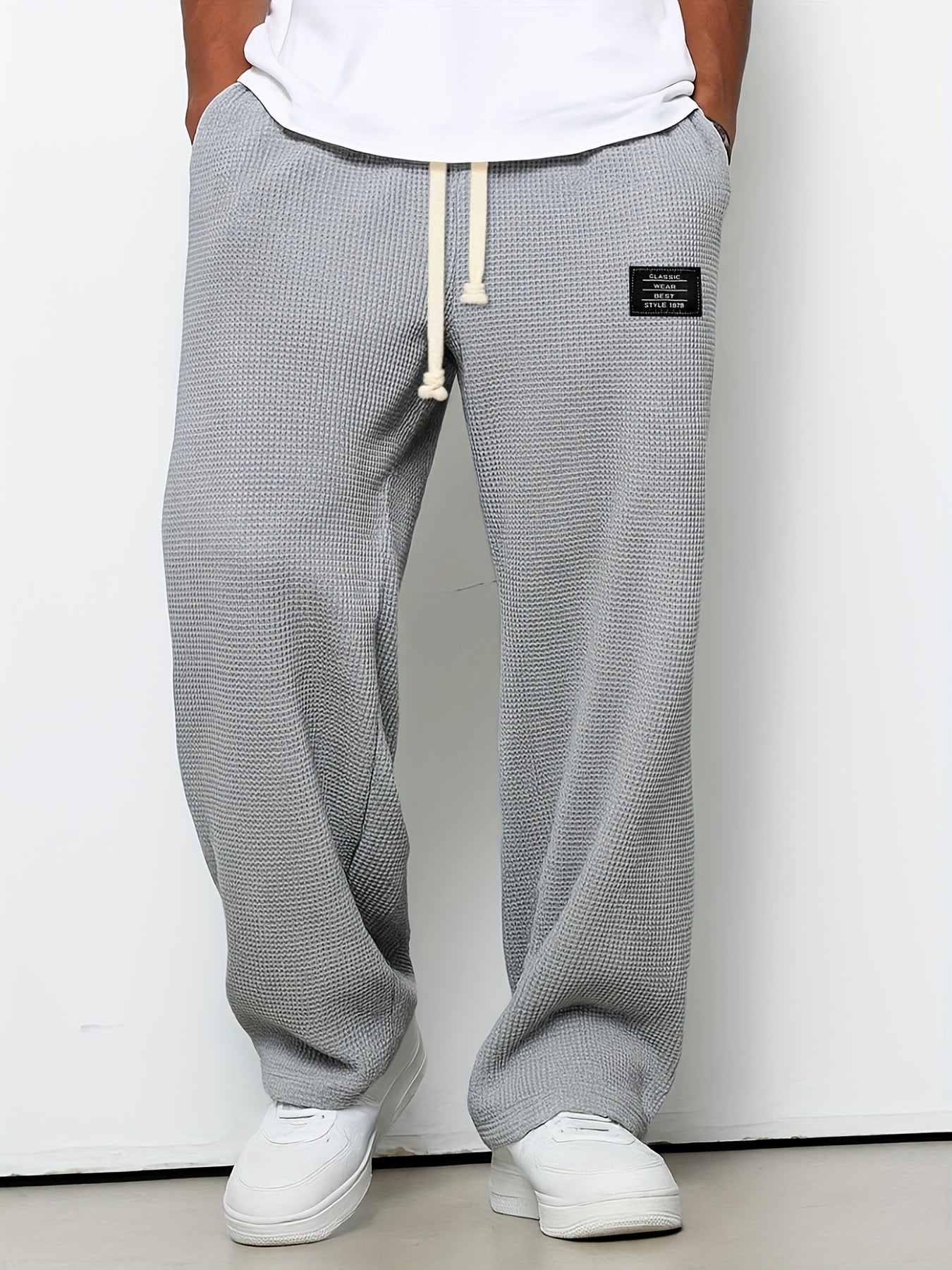 Unisex casual pants: comfortable, relaxed fit waffle knit lounge pants with a soft texture and wide leg.