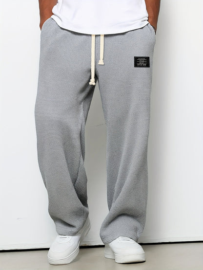 Unisex casual pants: comfortable, relaxed fit waffle knit lounge pants with a soft texture and wide leg.