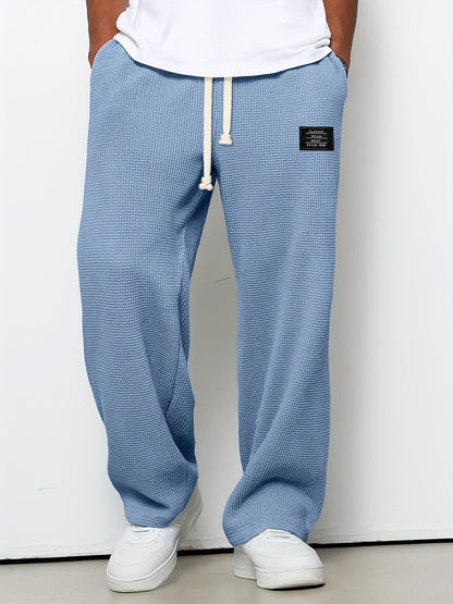 Comfortable unisex waffle knit lounge pants. Relaxed fit, soft casual pants with a wide leg and drawstring.