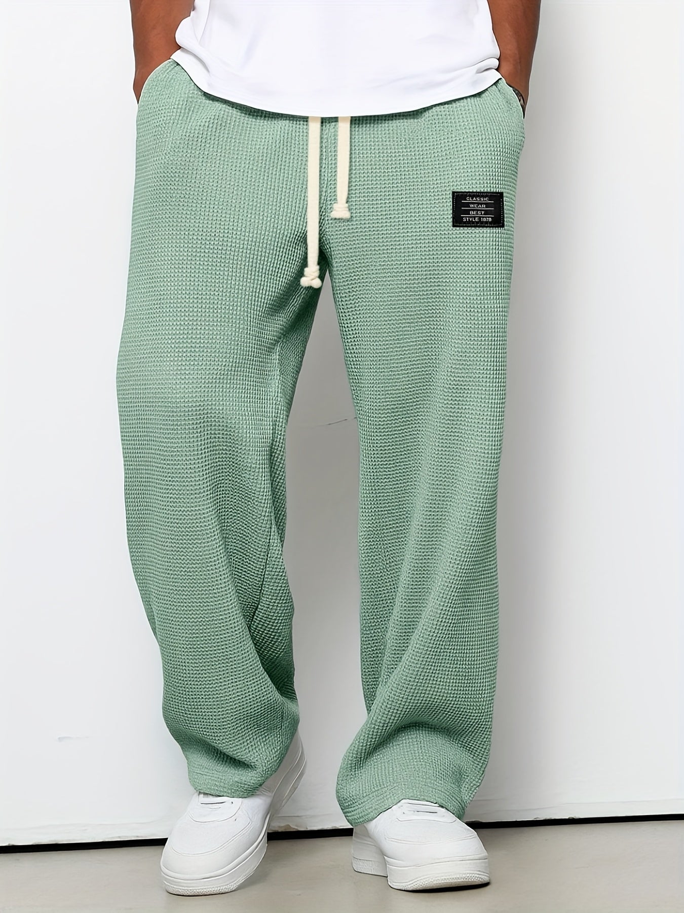 Unisex waffle knit relaxed lounge pants. Soft, textured comfort wear with a wide leg and adjustable drawstring.