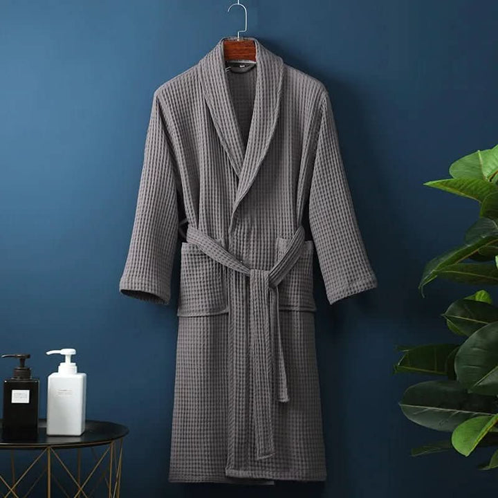 Close-up of soft waffle texture on a luxurious unisex bathrobe.