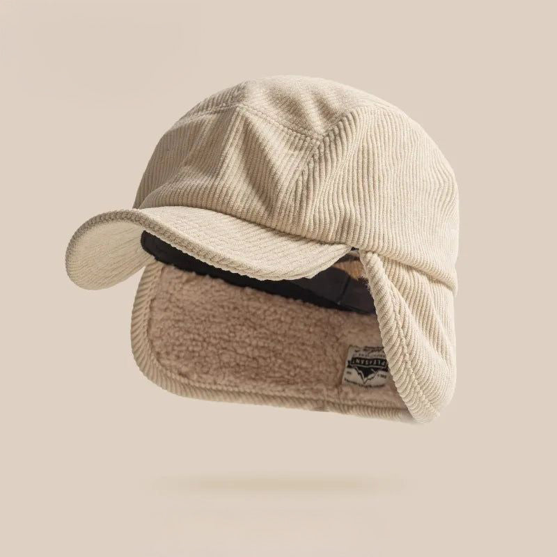 Soft beige knit earflap hat, a cozy unisex winter cap for maximum warmth and comfort.