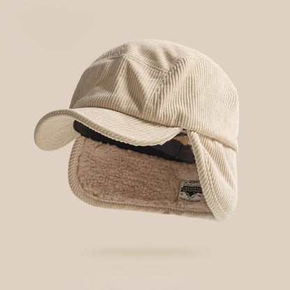 Soft beige knit earflap hat, a cozy unisex winter cap for maximum warmth and comfort.