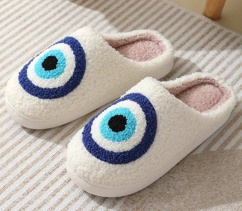 Plush, warm house slippers featuring an iconic deer motif, ideal for cozy non-slip wear.