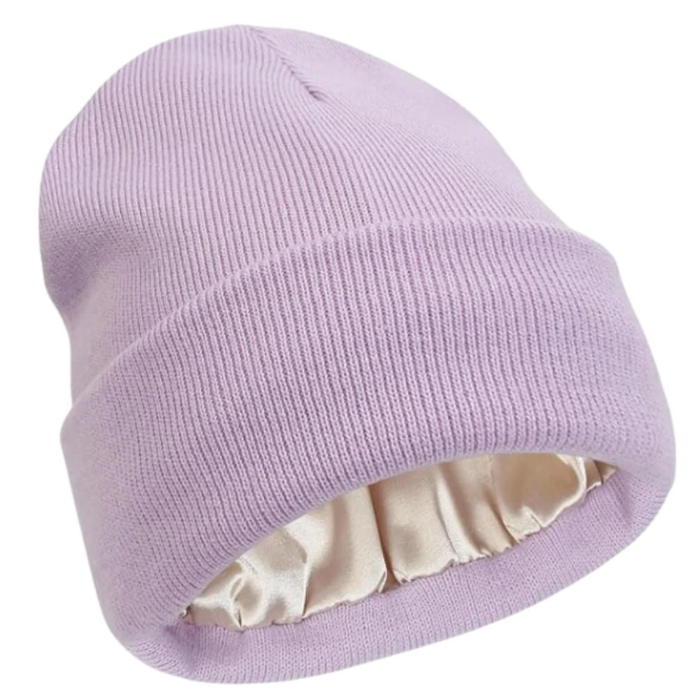 Close-up of a warm knit beanie with visible satin lining, showcasing hair protection features.