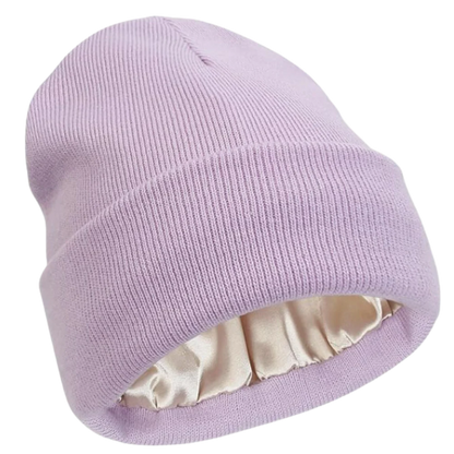 Close-up of a warm knit beanie with visible satin lining, showcasing hair protection features.