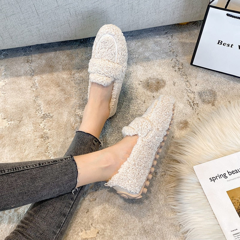 Cozy unisex winter house shoes, providing warm and soft indoor footwear for cold seasons.