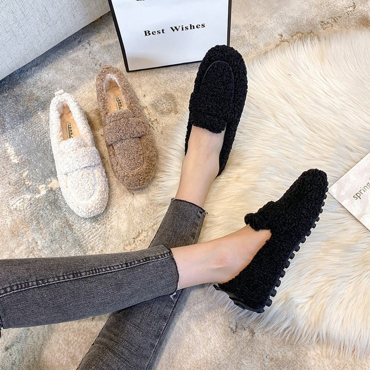 Warm plush slippers for men & women, ideal for ultimate winter comfort as indoor house shoes.