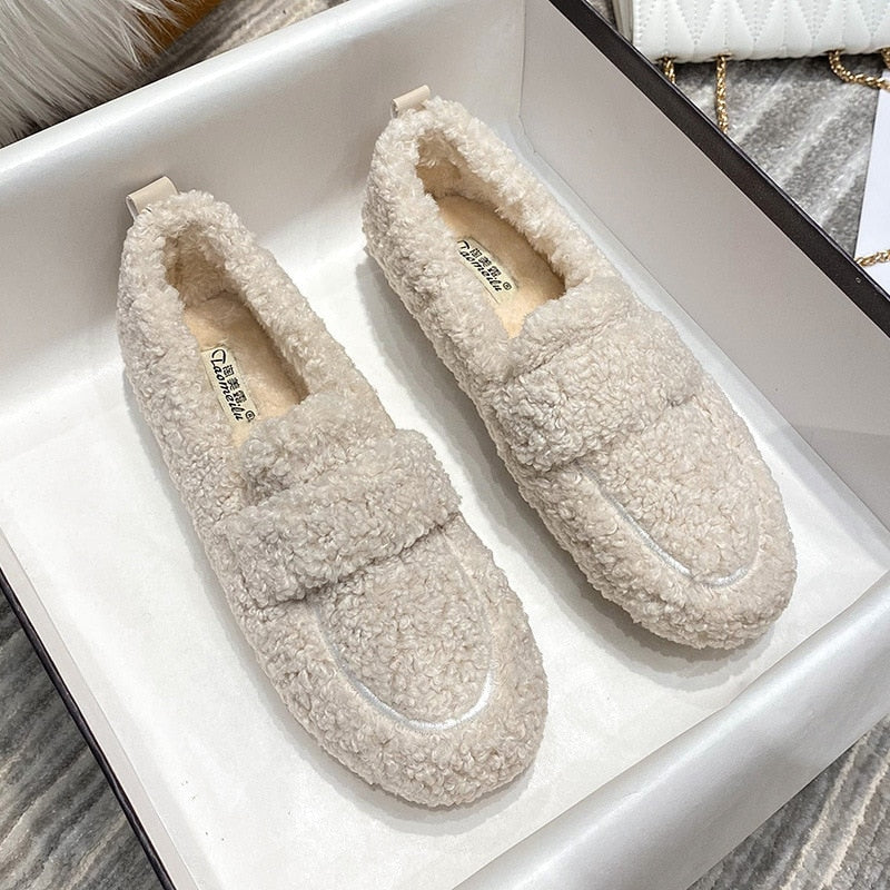 Comfortable unisex home slippers, keeping feet warm and cozy indoors during the winter.