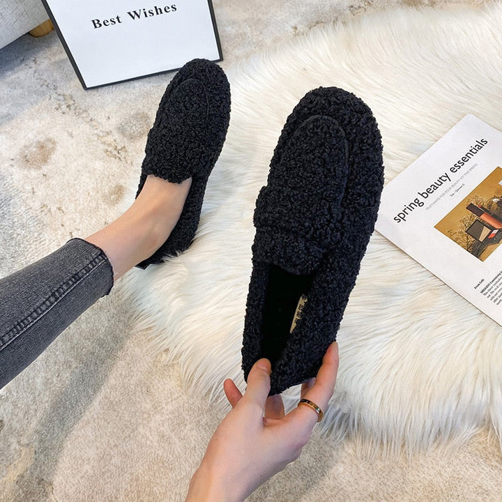 Warm and plush unisex winter slippers, offering cozy comfort for indoor use at home.