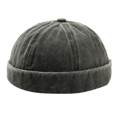 Unisex washed brimless cap with rolled cuff for casual street style.