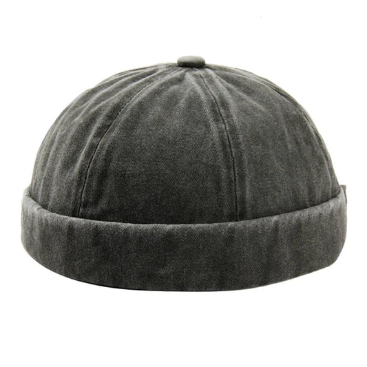 Unisex washed brimless cap with rolled cuff for casual street style.