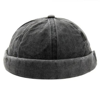 Khaki washed cotton brimless hat with rolled cuff, perfect casual headwear for all.