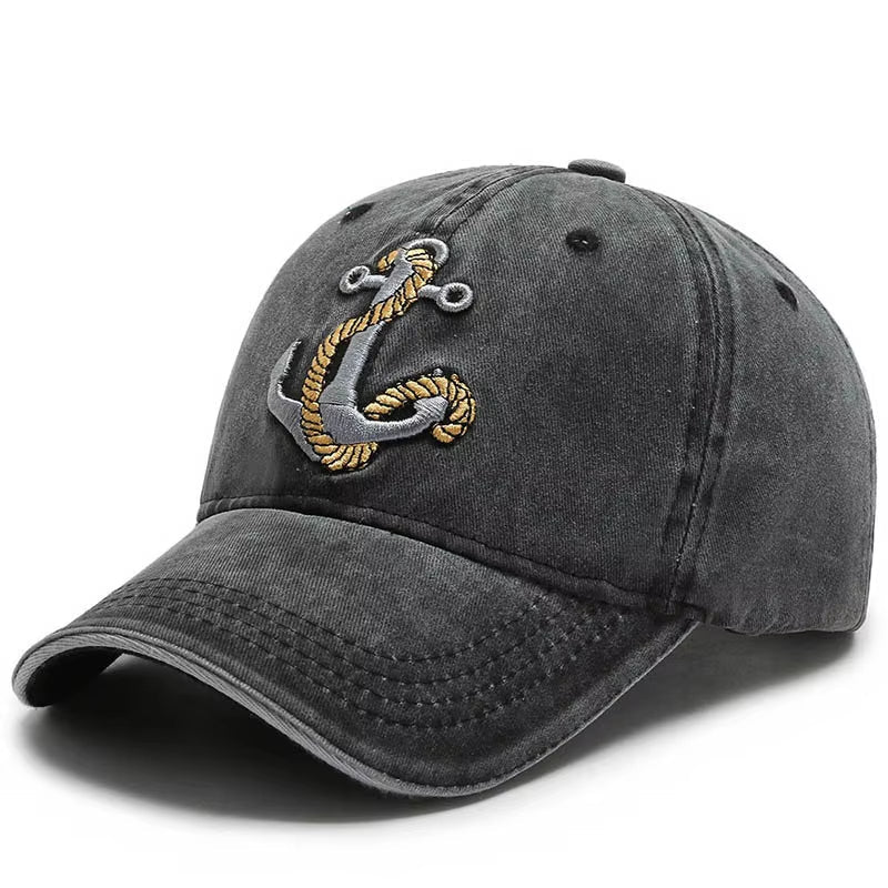 Unisex washed cotton baseball cap with embroidered anchor logo and adjustable strap.