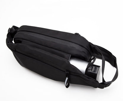 Convenient multi-pocket unisex fanny pack for hands-free travel. Water-resistant for sport & outdoor adventures.