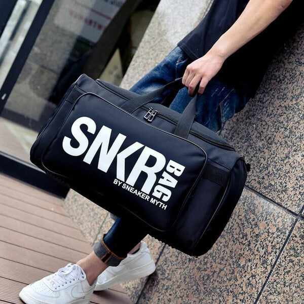 Unisex water-resistant travel bag. Multi-compartment duffel for organized sneakers & gear storage.