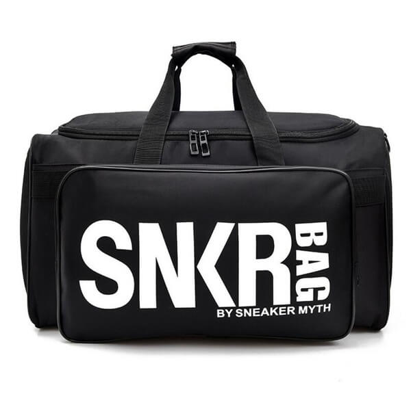 Close-up of water-resistant material on a unisex travel bag, designed for sneakers & sports gear.