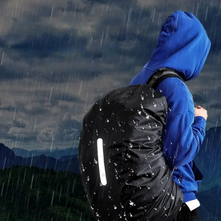 Reflective waterproof backpack cover for commuters. Adjustable, lightweight, keeps contents dry on daily trips.