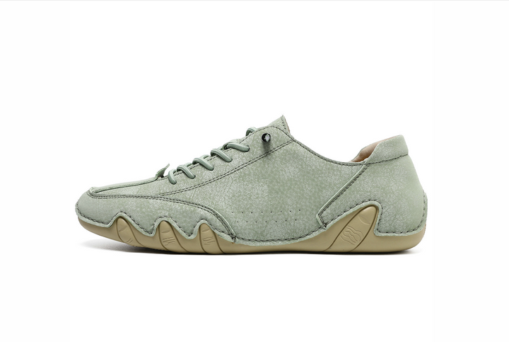 Side view of lightweight unisex waterproof barefoot shoes, minimalist design for comfortable walking & outdoor adventures.