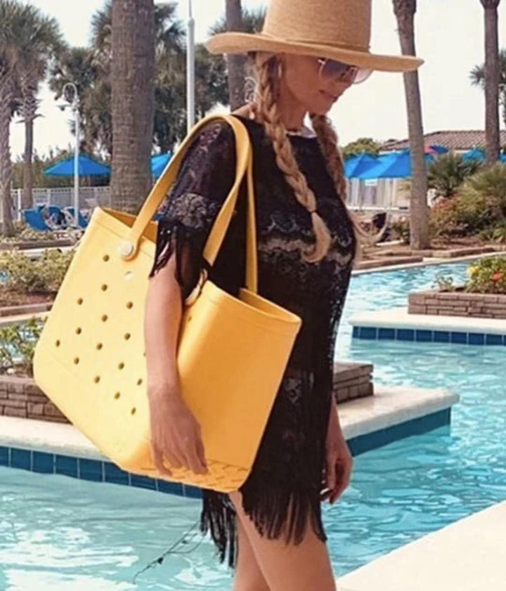 Large unisex beach tote, waterproof and draining design, ideal for carrying wet gear or groceries.