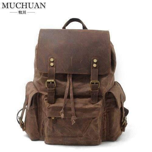 Ergonomic unisex large capacity backpack with waterproof canvas and leather details for hiking