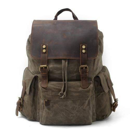 Side view of a large capacity waterproof canvas and leather backpack for hiking and outdoor use